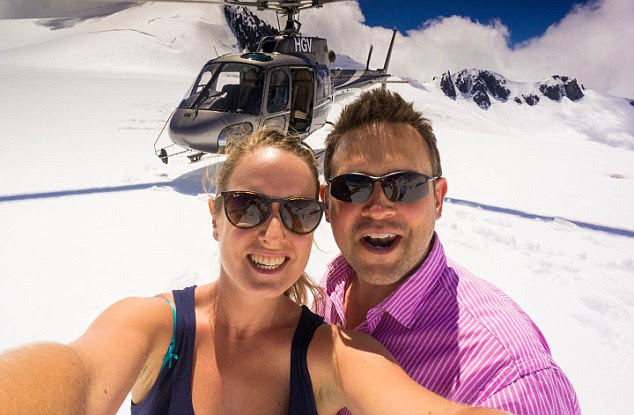 The pair live essentially rent-free and are able to take once-in-a-lifetime trips, such as this scenic helicopter flight in New Zealand