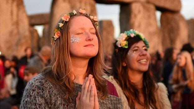 The BBC reported that about 12,000 people attended the neolithic site in Wiltshire to watch the sun rise at on June 20, 2016. Image via BBC