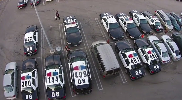Drone flies over an LAPD station's parking lot