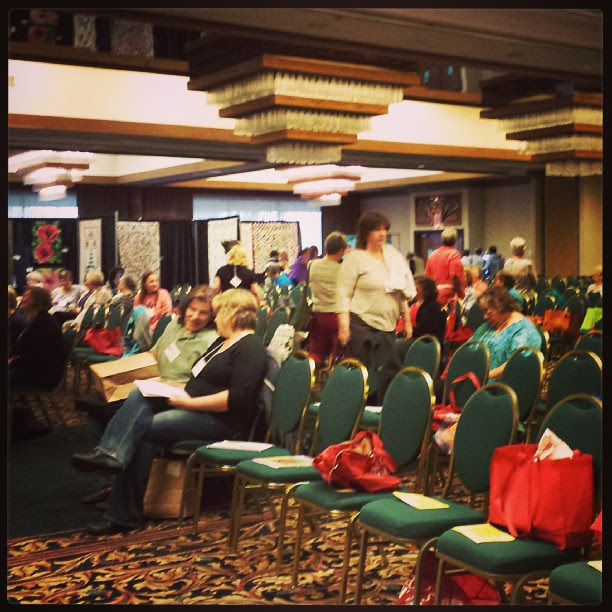 The doors have been open 10 minutes (at least 80 people here already).  Program starts in 50 minutes.  Who can say quilting is dead when 300 ladies (& 3 men) have gathered in Eastern Washington.  Again early morning - sigh #rickytims