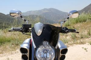Accessory windshield does an admirable job of deflecting wind while upping the Max’s appeal. 