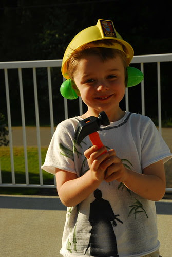 Aaron's hard hat , hammer and egg muffs