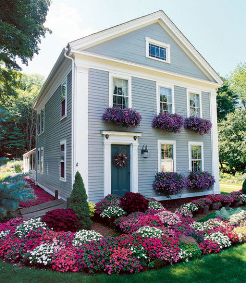 Overflowing with your favorite flowers, window boxes are a irresistible draw for the eye. Consider planting flowers in a shade that complements the color of your home. Or, for dramatic effect, mix in a second plant that picks up your trim color.
