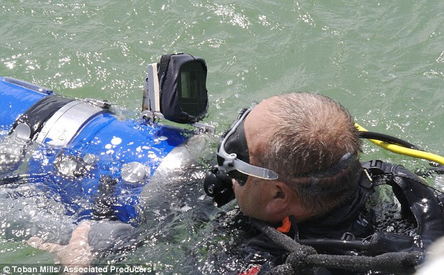 The team's underwater cameraman Sebastian Giner prepares to film the underwater site