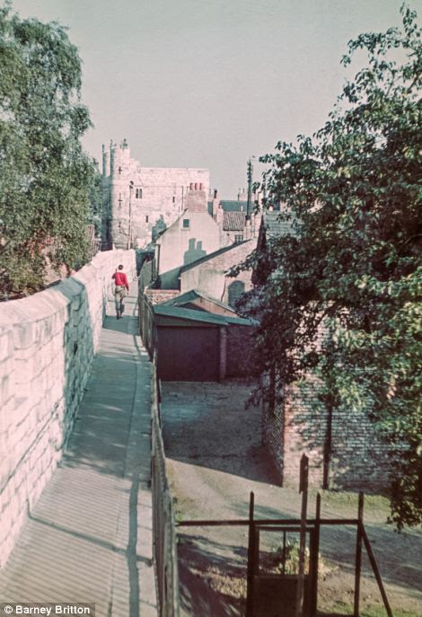 The honeymoon photos were taken as the Gardiners motored through the country in their Morris Eight. Above, Monk Bar in York