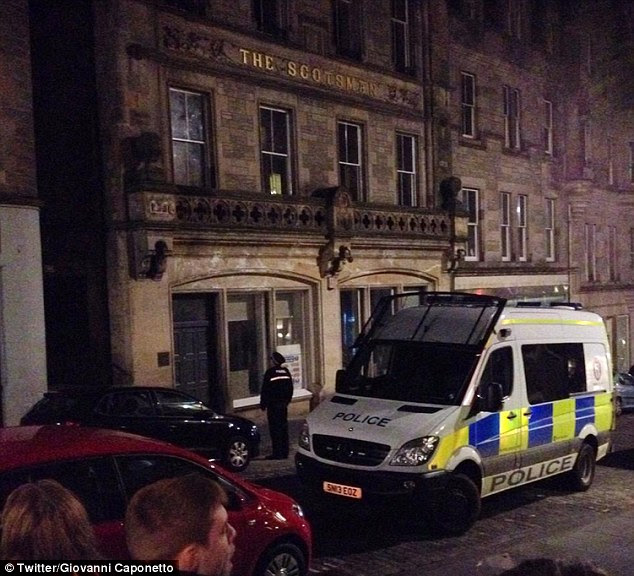 More than 50 officers wearing balaclavas and shields were deployed to Cockburn Street - near to where a shooting was earlier reported 