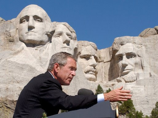 http://upload.wikimedia.org/wikipedia/commons/a/a3/Bush_at_Mount_Rushmore.jpg
