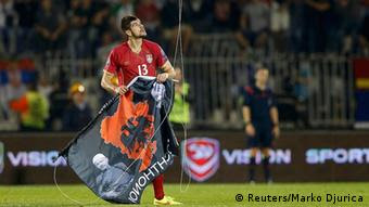 Stefan Mitrovic of Serbia grabs a flag depicting so-called Greater Albania
Photo: REUTERS/Marko Djurica 