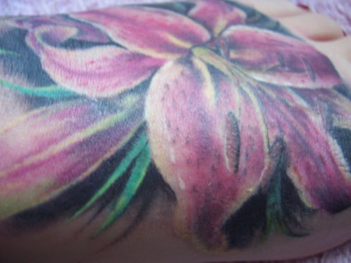 tiger lily. my beautiful tiger lilly tattoo on my left foot, i love it. done 