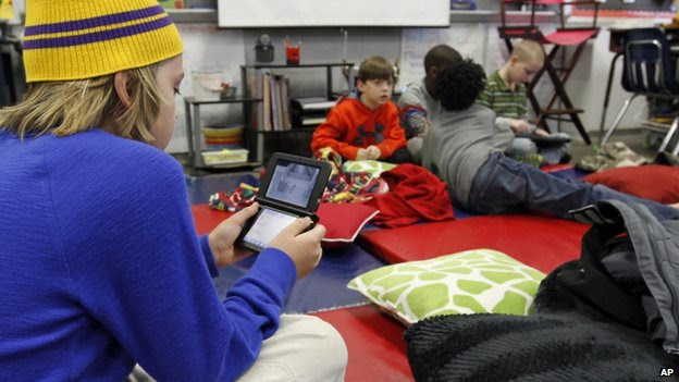 A student played an electronic game at Oak Mountain Intermediate school in Indian Springs, Alabama, on 29 January 2014