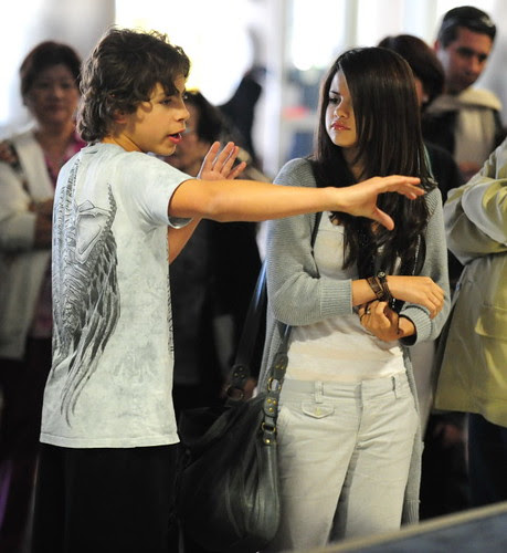 Selena Gomez And Co-Star Jake Austin Stay Close At LAX