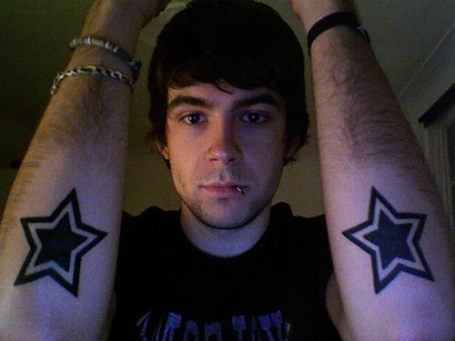 TATTOO LASER.tattoo star tattoo on his hand and ice cream