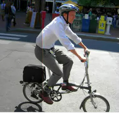 Man on a folding bike