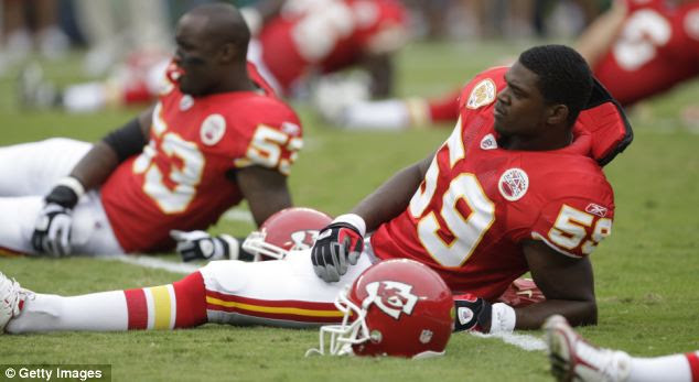 Jovan Belcher #59 stretches before a game against the Oakland Raiders at Arrowhead Stadium in 2009