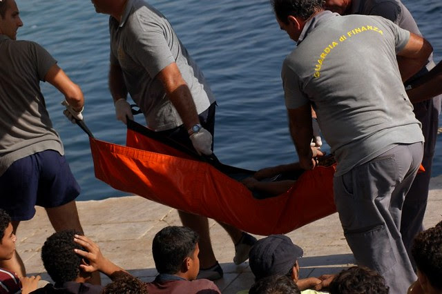 Victims of the disaster near Lampedusa taken away by the Guardia di Finanza