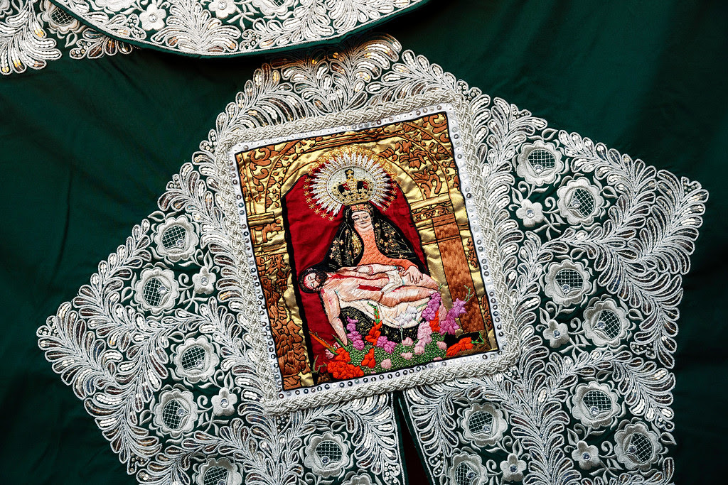 Description of . In this photo taken Saturday, May 30, 2015, an image depicting a religious scene embroidered in a capote, or bullfighters cape, is displayed during a bullfight  in Aranjuez, near Madrid, Spain. Bullfighting is an ancient tradition in Spain. (AP Photo/Daniel Ochoa de Olza)