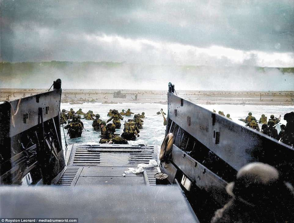 A landing craft form the USS Samuel Chase lands troops of US Army First Division on Omaha, the most famous and easily the bloodiest landing of the Normandy invasion where up to 4,700 of the 43,000 Allied troops were cut down by the defending Germans as they rushed ashore