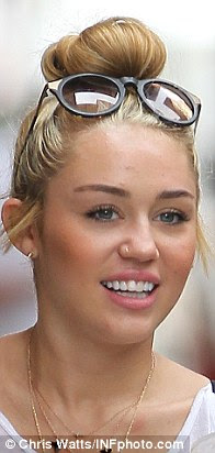 Indecisive: Miley likes to change her style, pictured at the 2012 
People's Choice Awards in January 