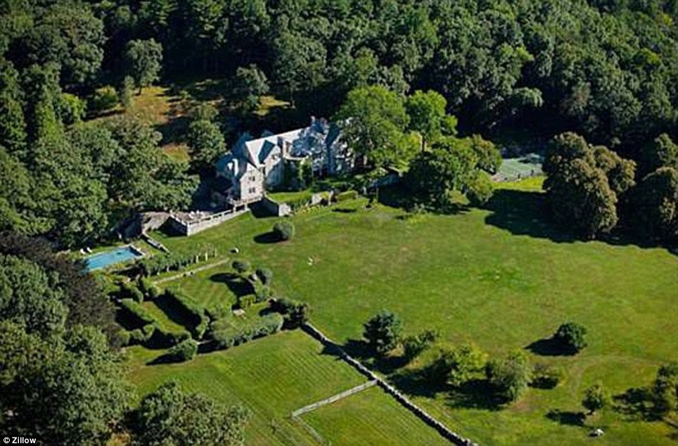 The home includes an Olympic-sized swimming pool and tennis court, and is on the National Register of Historic Places