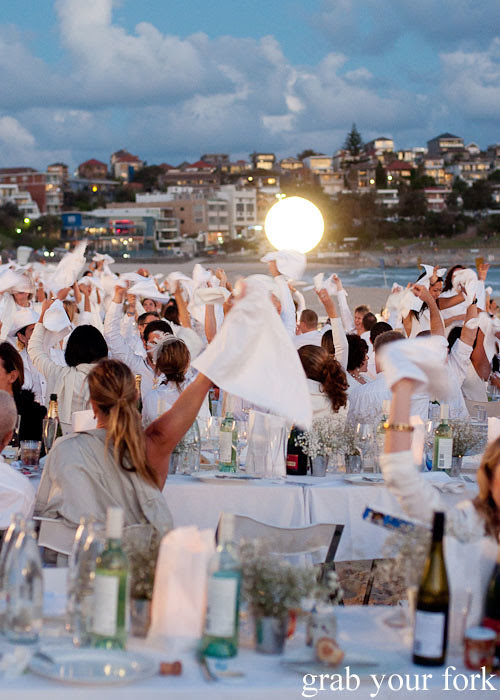 Napkin waving at Diner en Blanc Sydney 2013 Bondi Beach