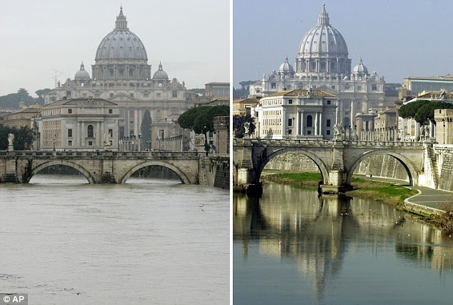 Danger zone: Left, the swollen Tiber river, downtown Rome, near the Vatican's St. Peter's Basilica on Thursday. Right, the Tiber in the same place at its normal levels (file photo) 