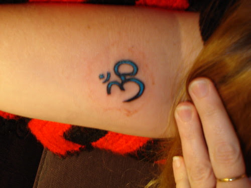 My Christmas present is a tattoo, my fourth. It is an Om (also called Aum) 