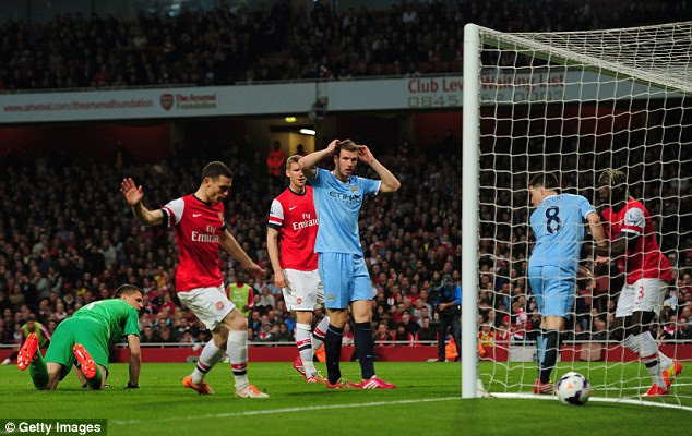 Unlucky: The ball dribbles wide a City have a chance to take the lead for a second time