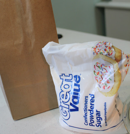 While the Zeppole cool enough to be handled, scoop some powdered sugar into a lunch bag. Drop in a piece of the fried dough and give it a good shake then be prepared to fight people off.