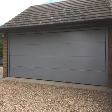 A lot of homes have a security screen door. Insulated Sectional Garage Door in RAL 9006 White