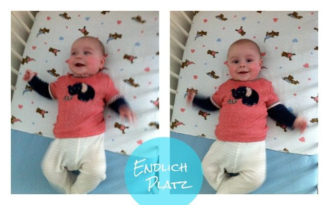 Baby im Gitterbett