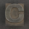 Caslon metal type letter C