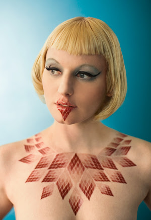 I place the skin tattoos back on skin, adorning myself with a longer lasting 