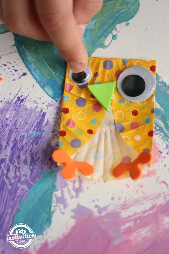 Adding eyes and beak to cupcake liner owl