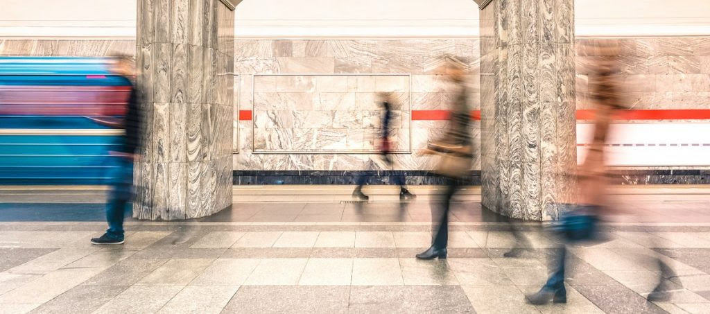 Blurred people walking on generic platform of underground subway metro station - Urban public transportation concept with passengers commuting at rush hour - Defocused motion blurry composition