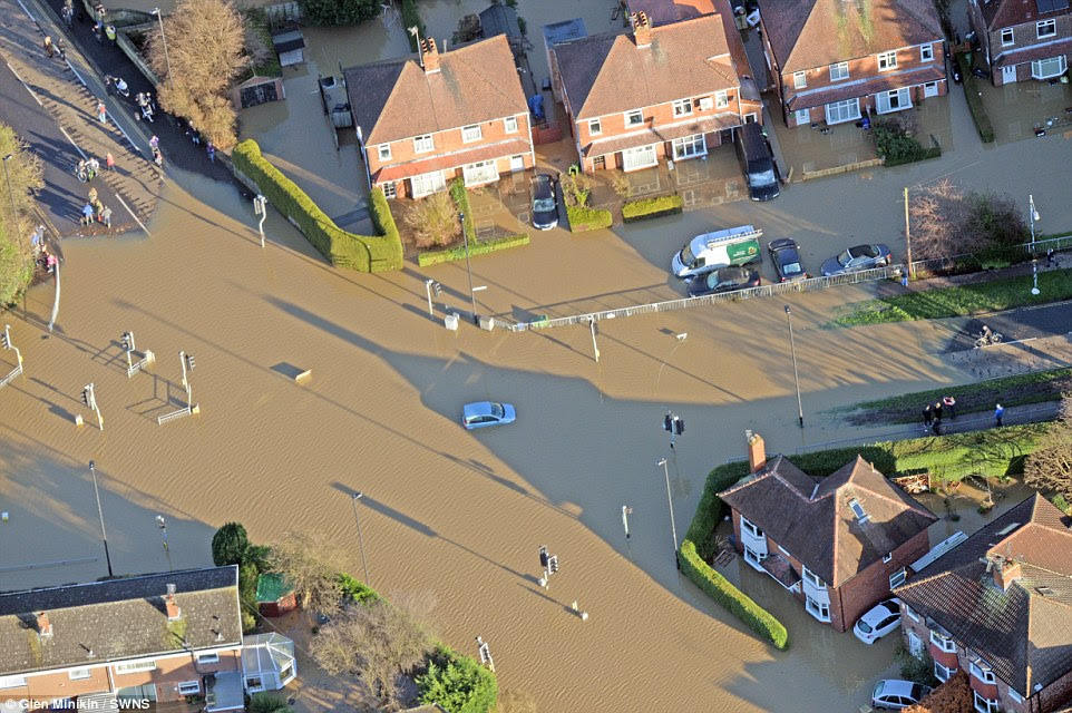 Where has the road gone? Murky floodwater completely covered part of the main road through York after the city was hit by rainfall