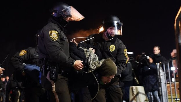Police arrest a protester in Ferguson, Missouri, 25 November 2014