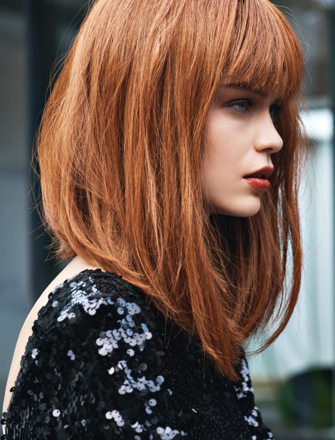 Red hair in a long bob with a back to front angle