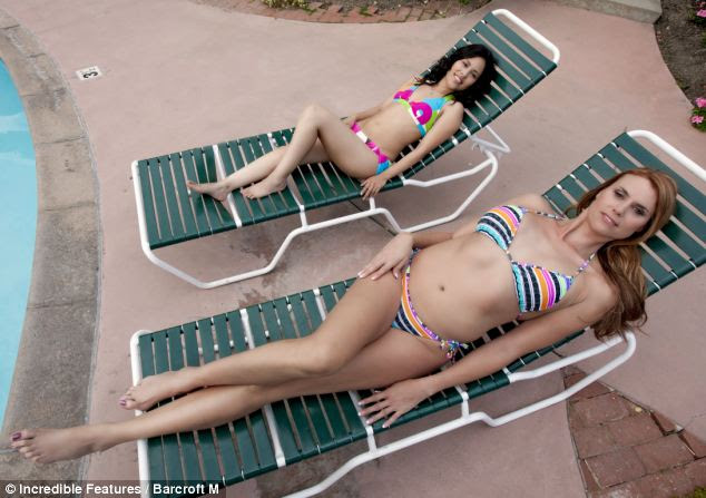 I'm gonna need a bigger lounger: Even lying down Amazon Eve's height is clear as she lies next to model Qeyda Penate 