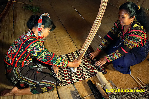 Polishing the T'nalak cloth