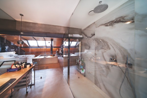 Marble walls in the shower are both practical and beautiful.