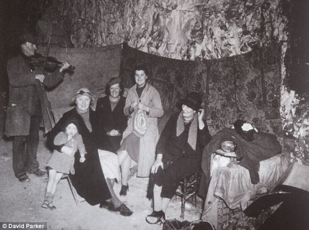 Blitz spirit: Frank the fiddler brightens up life in the labyrinth of tunnels beneath the town of Ramsgate in Kent which saved hundreds of the town's residents from German bombs during the Second World War
