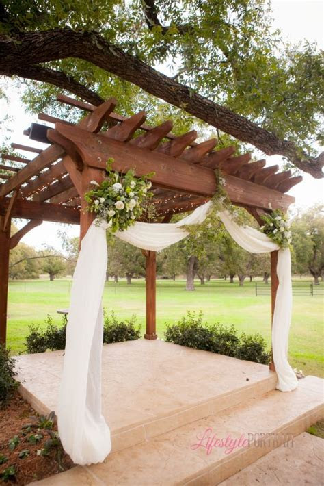 lifestyle portrait wedding pergola decoration green