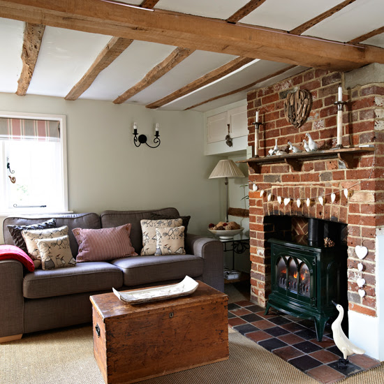 Country living  room  with wooden beams and exposed brick  