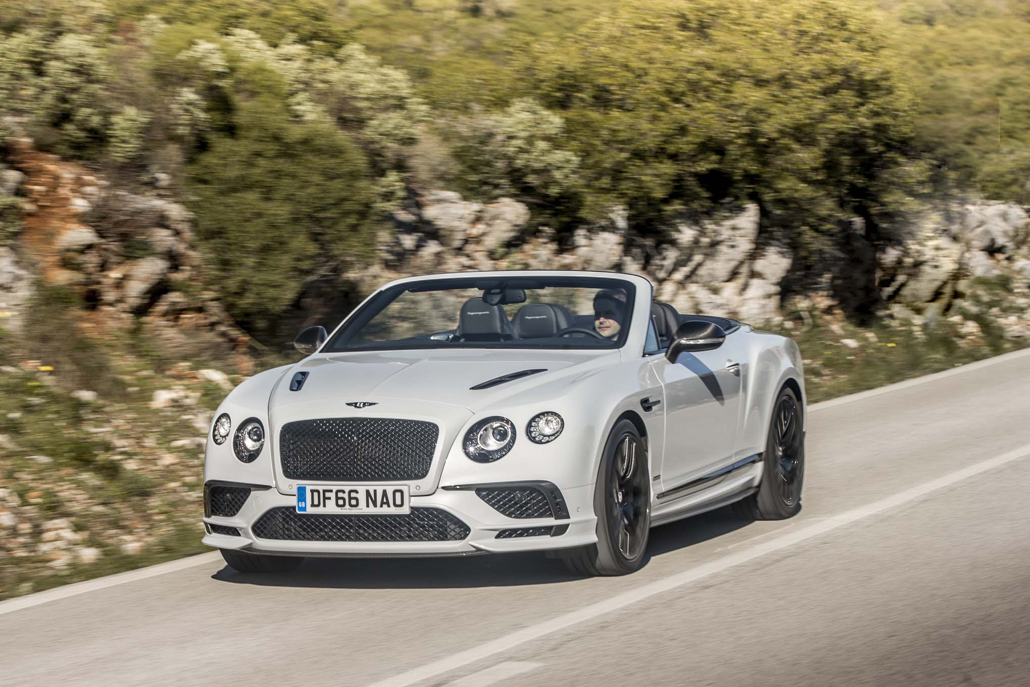 2017 Bentley Continental Supersports convertible front three quarter in motion 04