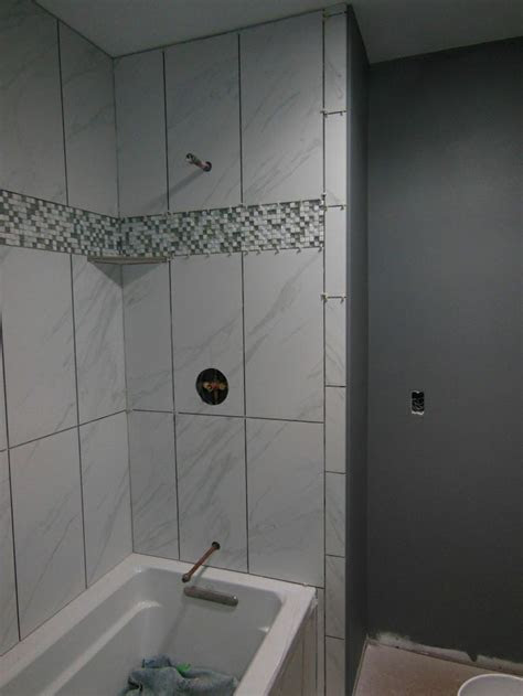 Shop our huge selection of pebbles & stone tile and get expert advice and assistance from the tile shop. badgergal's image | Tile tub surround, Large shower tile