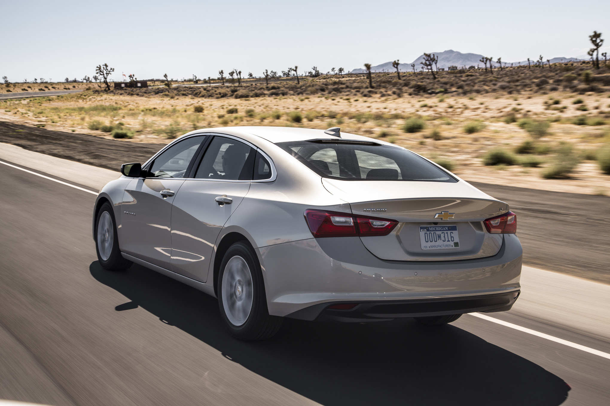 2016 Chevrolet Malibu 1LT rear three quarter in motion