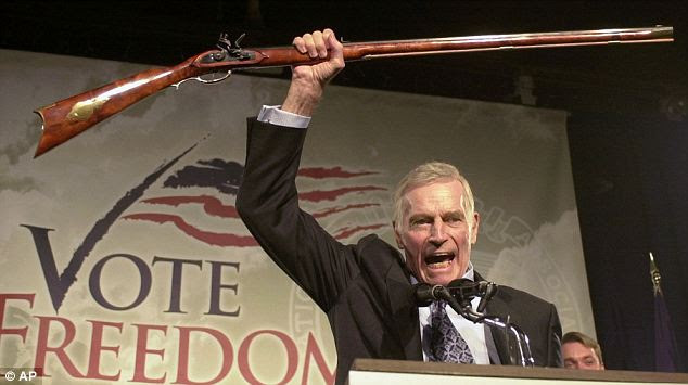 Pro gun: The late Charlton Heston at a 2002 rally
