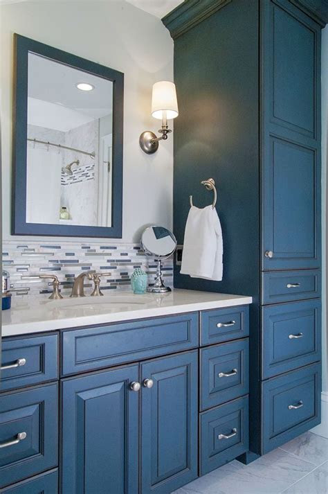Position a freestanding bath to create an illusion of space. Cute idea for backsplash -- could echo in shower inset