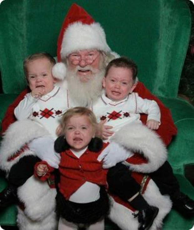 Irmãos choram ao tirar foto com papai noel (Foto: Reprodução)