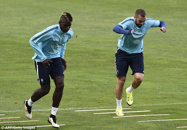 Pogba trains with France team-mate Karim Benzema - who also wasn't keen on a move to the Premier League
